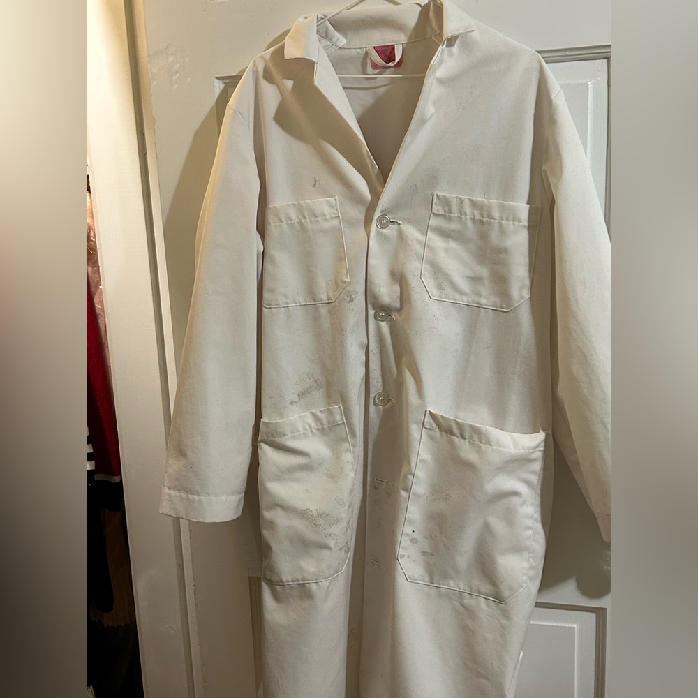 White lab coat with buttons. 35 %cotton,65 polyester , minor stains,4 pocket